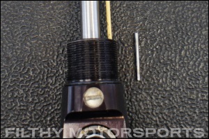 Closeup photo of an ORI STX Strut lower rod end rebound adjustment knob