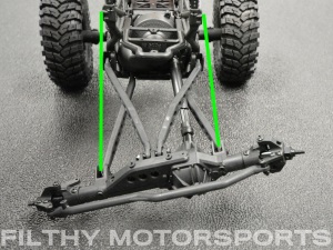 A photo of a vehicle chassis at full extension with arrows between the shock mounts
